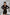ELAGIA black crop jacket skirt suit 2-piece detail shot highlighting cropped blazer styling and fabric texture