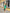 ELAGIA Green One-Shoulder Satin Midi Dress - detailed close-up of fabric texture and 3 piece women's suit styling