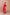 Close-up detail of ELAGIA red thigh-slit maxi dress fabric texture and seaming construction