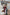 ELAGIA Bordeaux Puff-Sleeve Midi Dress sizing guide on model wearing 3 piece women's suit style dress