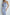 ELAGIA sky-blue one-shoulder satin midi dress close-up of draped shoulder detail and quality satin construction