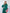 ELAGIA Emerald Silk Long Sleeve Maxi Dress - three-quarter angle view showing dress movement and elegant draping