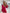 ELAGIA Crimson Silk Long Sleeve Ruched Mini Dress - angled view emphasizing ruched side panel design details