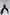 ELAGIA women's black suit set texture detail - Black Cross-Neck Sleeveless Jumpsuit fabric close-up