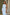ELAGIA white one-shoulder belted midi dress fabric drape detail and sleeve construction close-up