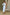 ELAGIA white one-shoulder belted midi dress neckline and shoulder detail showcasing asymmetrical cut
