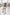 ELAGIA white high waist slit cuff culottes front view - white suit for women with wide leg design
