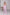 ELAGIA pink suit - back view of hot pink deep V-neck sleeveless jumpsuit showing design details