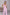 ELAGIA hot pink suit womens - side detail of pink deep V-neck sleeveless jumpsuit styling
