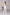 ELAGIA white deep V-neck sleeveless jumpsuit detail view of neckline and bodice construction