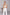 ELAGIA white suit for women - sleeveless deep V-neck jumpsuit front view on model