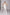 ELAGIA white suit for women styled look - model wearing sleeveless V-neck jumpsuit full body shot