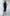 ELAGIA black one-shoulder belted midi dress lifestyle shot showing dress in motion and drape
