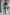 ELAGIA Monika Green Backless Jumpsuit - shoulder and neckline detail of green business suit design