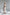 ELAGIA beige one-shoulder cut-out midi dress front view - neutral tone asymmetrical dress with side cutout