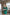 ELAGIA Emerald Satin Long Sleeve Mini Dress - front view of luxurious green mini dress with long sleeves