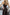 ELAGIA black cross-neck sleeveless jumpsuit detail of neckline and fit - women's black suit set feature