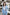 ELAGIA sky-blue shawl lapel suit lifestyle shot - woman wearing complete 3 piece women's suit ensemble