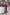 ELAGIA Fuchsia Satin Long Sleeve Maxi Dress - styled model wearing vibrant pink evening gown in full length