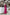 ELAGIA Fuchsia Satin Long Sleeve Maxi Dress - side angle view showcasing flowing drape of bright pink satin dress