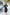 Black V-neck Buttoned Puff-Sleeve Midi Dress - front view | ELAGIA