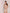 ELAGIA gold one-shoulder satin mini dress lifestyle shot on model in party setting