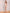 ELAGIA gold one-shoulder satin mini dress fabric detail showing lustrous satin finish