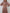 ELAGIA Fraise Silk Long Sleeve Maxi Dress styled look - model wearing pink maxi with 3 piece women's suit vibes