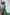 ELAGIA emerald green jumpsuit close-up of neckline and upper body styling details