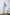 ELAGIA 3 piece women's suit style sky blue satin set modeled in natural lighting full length view