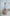 ELAGIA sky-blue crop jacket skirt suit - side profile view showcasing modern business wear silhouette