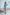 ELAGIA green satin long sleeve mini dress detail shot showing fabric texture and tailored fit