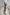 ELAGIA Graphite Puff Sleeve Wrap Dress on model sitting - 3 piece women's suit style charcoal dress