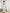 ELAGIA Grey Sweetheart Puff-Sleeve Top - close-up of elegant white dress long sleeve neckline and puff sleeves