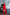 ELAGIA red women's business suit - alternative angle highlighting double breasted design elements