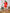 ELAGIA red puff-sleeve v-neck mini dress back view showing zipper detail - 3 piece women's suit collection
