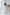 ELAGIA white V-neck sleeveless jumpsuit front view - white suit for women with clean tailored lines