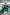 ELAGIA Emerald Satin Cloak Sleeve Mini Dress draped styling shot - 3 piece women's suit sophistication