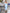 ELAGIA sky-blue satin midi dress styled shot, modern take on purple business suit women classic silhouette