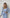 ELAGIA light blue suit women 2-piece set side view - sky-blue long sleeve top with flowing maxi skirt