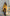 ELAGIA Mustard Belted Trench Coat front view - mustard trench coat with belt tie and classic collar design