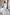 ELAGIA white business suit women - pants detail showing wide-leg cut and belt coordination with blazer