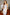 ELAGIA silver one-shoulder satin midi dress - angled view showing movement and flow of satin material