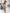 ELAGIA red sweetheart corset top model view - womens red suit set structured top in lifestyle setting
