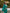 ELAGIA green double breasted 3 piece women's suit full length styled view with accessories for business setting