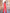 ELAGIA coral 3 piece women's suit lifestyle shot - professional business wear styling and fit