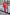 ELAGIA red women's business suit worn by model in office setting - professional 2-piece outfit