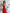 ELAGIA red strapless jumpsuit side angle detail - womens red suit set with v-neckline styling