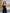 ELAGIA womens black suit - lifestyle shot of model wearing strapless V-neck jumpsuit