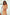 ELAGIA beige off-shoulder maxi dress detail shot highlighting neckline and fabric drape for women's formal wear